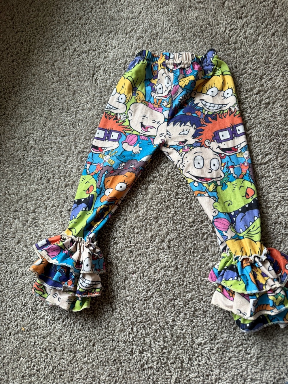 Girls rugrat printed ruffle pants.
